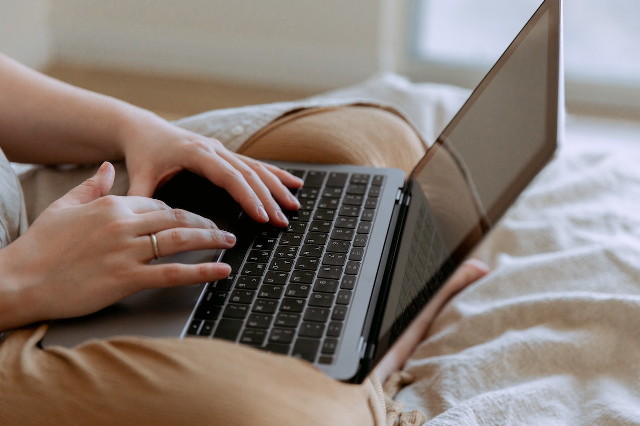 a person typing on a laptop's keyboard
